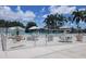 Gated community pool area with tables at 115 White Oak Way, Sarasota, FL 34237
