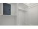 Small storage room with shelving and electrical panel at 115 White Oak Way, Sarasota, FL 34237