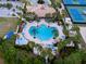 Aerial view showcasing community pool and tennis courts at 11692 Spotted Margay Ave, Venice, FL 34292
