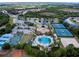 Aerial view of community with pool, tennis courts, and sports areas at 11692 Spotted Margay Ave, Venice, FL 34292