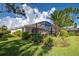 Landscaped backyard with pool and patio at 11692 Spotted Margay Ave, Venice, FL 34292