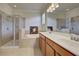 Bathroom boasts double vanity, soaking tub, and a walk-in shower at 11692 Spotted Margay Ave, Venice, FL 34292