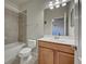 Clean bathroom with tub shower, toilet and vanity at 11692 Spotted Margay Ave, Venice, FL 34292