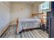 Bedroom with wood framed bed and dresser at 11692 Spotted Margay Ave, Venice, FL 34292