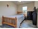 Bedroom with wood framed bed and dresser at 11692 Spotted Margay Ave, Venice, FL 34292