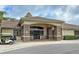 Elegant community center with stone accents and welcoming entryway at 11692 Spotted Margay Ave, Venice, FL 34292