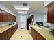 Community kitchen with ample cabinetry and countertops at 11692 Spotted Margay Ave, Venice, FL 34292
