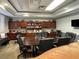 Spacious community room with a large table and bookcases at 11692 Spotted Margay Ave, Venice, FL 34292