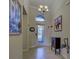 Bright and spacious entryway with tile flooring and decorative accents at 11692 Spotted Margay Ave, Venice, FL 34292