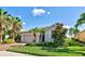 Attractive house with a landscaped yard and palm trees at 11692 Spotted Margay Ave, Venice, FL 34292