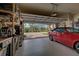 Garage with open door, plenty of storage, and room for a car at 11692 Spotted Margay Ave, Venice, FL 34292