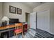 Home office with wood desk and built in closet at 11692 Spotted Margay Ave, Venice, FL 34292