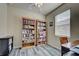 Home office with built-in shelving and hardwood floors at 11692 Spotted Margay Ave, Venice, FL 34292