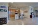Kitchen with island, stainless steel appliances, and wood cabinets at 11692 Spotted Margay Ave, Venice, FL 34292