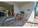 Relaxing patio with seating area, view of living room at 11692 Spotted Margay Ave, Venice, FL 34292