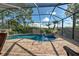 Enclosed pool and spa with brick pavers at 11692 Spotted Margay Ave, Venice, FL 34292