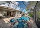 Enclosed pool and spa with brick pavers at 11692 Spotted Margay Ave, Venice, FL 34292