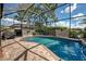 Enclosed pool and spa with brick pavers at 11692 Spotted Margay Ave, Venice, FL 34292