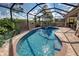 Enclosed pool and spa with brick pavers at 11692 Spotted Margay Ave, Venice, FL 34292