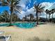 Relaxing resort-style pool with lounge chairs and palm trees at 11692 Spotted Margay Ave, Venice, FL 34292