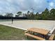 Beach volleyball court with a picnic table for relaxing at 11692 Spotted Margay Ave, Venice, FL 34292