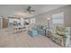 Comfortable living room with a view into the kitchen and dining area at 12029 Tapestry Ln, Venice, FL 34293