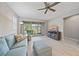 Relaxing living room with sliding doors leading to a patio at 12029 Tapestry Ln, Venice, FL 34293