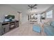 Spacious living room with fireplace, TV and plenty of natural light at 12029 Tapestry Ln, Venice, FL 34293
