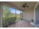 Screened in porch with patio furniture and view of backyard at 12029 Tapestry Ln, Venice, FL 34293