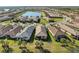 Community overview featuring a lake and numerous houses at 12861 Oriago St, Venice, FL 34293
