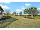 Backyard with tropical landscaping at 12861 Oriago St, Venice, FL 34293