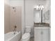 Bathroom with tub, toilet and granite countertop at 12861 Oriago St, Venice, FL 34293