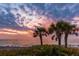 Stunning beach sunset with palm trees silhouetted at 12861 Oriago St, Venice, FL 34293
