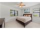 Bright bedroom with a ceiling fan and large windows at 12861 Oriago St, Venice, FL 34293