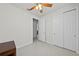 Bedroom with neutral walls, tiled floor, ceiling fan and closet space at 12861 Oriago St, Venice, FL 34293