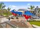 Community plaza with shaded seating and modern design at 12861 Oriago St, Venice, FL 34293