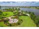 Firepit and seating area with landscaping and lake views at 12861 Oriago St, Venice, FL 34293