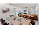 Spacious dining area with glass-top table, view of living room and kitchen at 12861 Oriago St, Venice, FL 34293