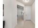 Bright and airy entryway with tile floors and a view to the living room at 12861 Oriago St, Venice, FL 34293