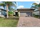 Front view of a single-story house with a landscaped yard at 12861 Oriago St, Venice, FL 34293
