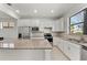 Modern kitchen with stainless steel appliances and granite countertops at 12861 Oriago St, Venice, FL 34293