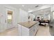Kitchen with granite island, stainless steel appliances, and pantry at 12861 Oriago St, Venice, FL 34293