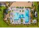 Aerial view of community pool and lounge chairs at 12861 Oriago St, Venice, FL 34293