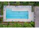 Community lap pool with lounge chairs and palm trees at 12861 Oriago St, Venice, FL 34293