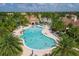 Freeform community pool with many residents enjoying the water at 12861 Oriago St, Venice, FL 34293