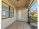 Cozy screened porch with brick flooring at 12861 Oriago St, Venice, FL 34293