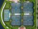 Aerial view of eight community tennis courts at 12861 Oriago St, Venice, FL 34293