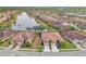 Community overview featuring lakefront villas and lush landscaping at 1375 Maseno Dr, Venice, FL 34292