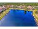 Aerial view of community with lake and numerous homes at 1375 Maseno Dr, Venice, FL 34292