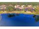 Aerial view of lakefront community with lush landscape at 1375 Maseno Dr, Venice, FL 34292